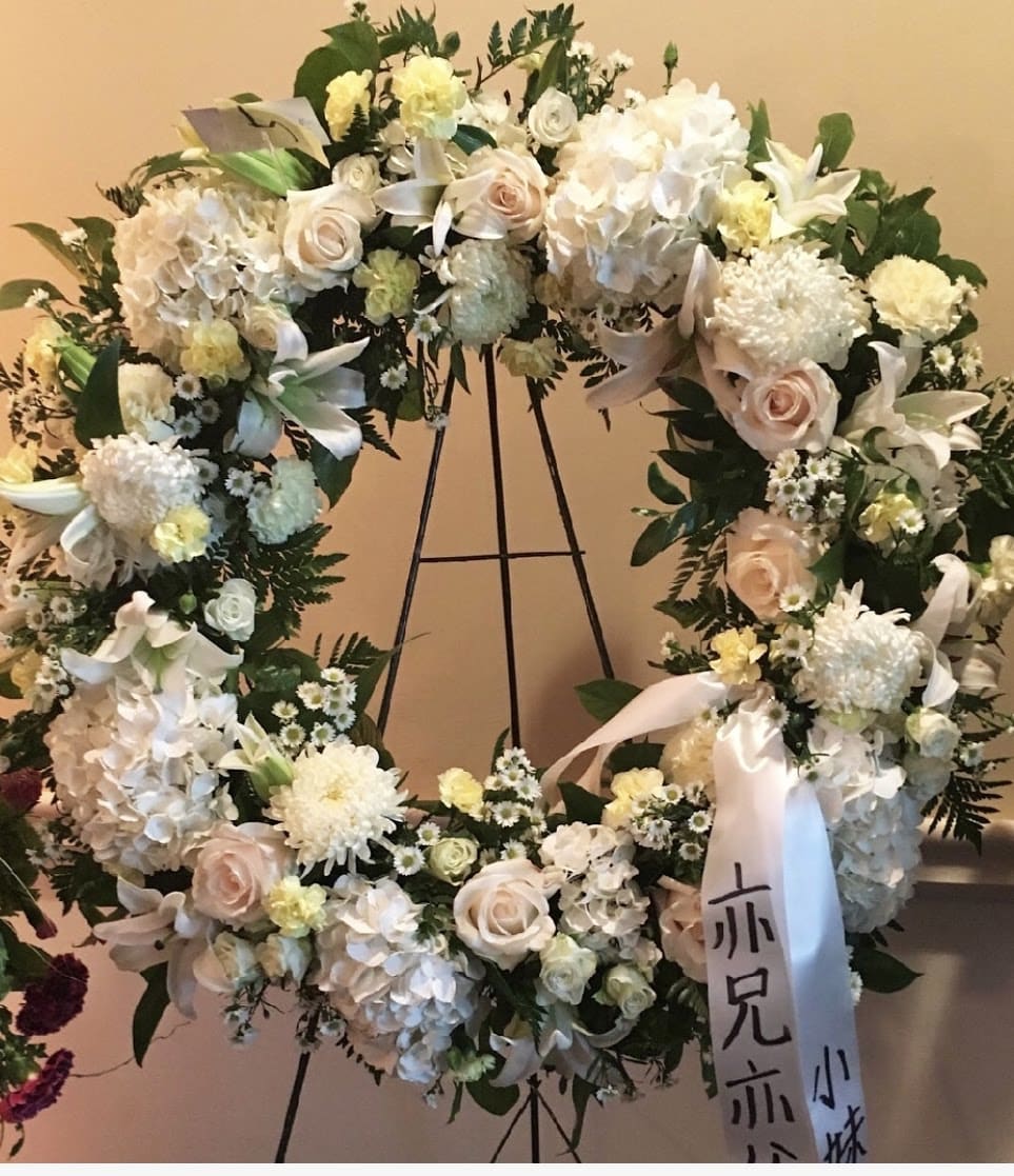 White Elegance Wreath White Elegance Wreath - A traditional white sympathy wreath.