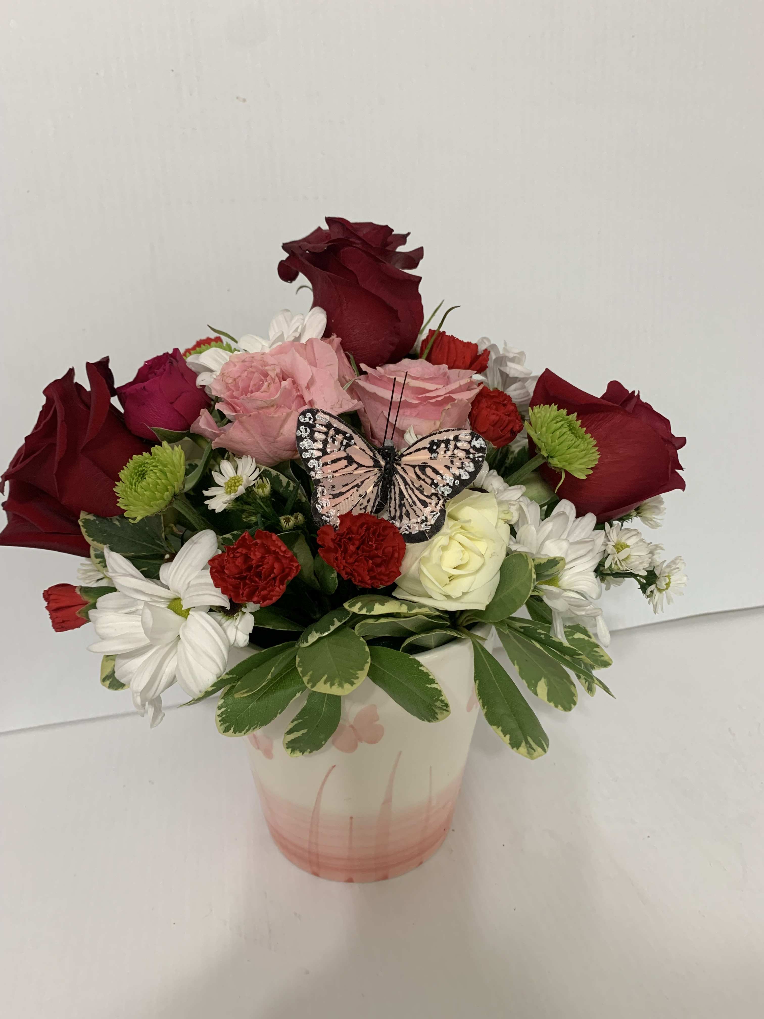 Pink Butterfly Kisses - 5&quot; Pink ceramic butterfly pot with color flower arrangement If pink is not available we will substitute yellow or green