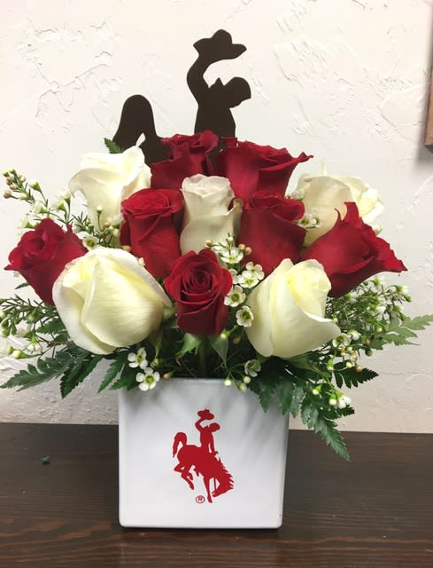 Wyoming Cowboy Sweetheart - Arrangement includes red and white roses, filler, greenery and vase with Wyoming Cowboy logo