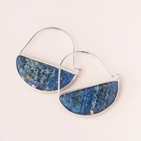 Prism Hoop Earring - Lapis/Silver - Our new line of minimalistic charm to adorn your ears. Lightweight with the perfect amount of color and shape. Choose from silver or gold for an alluring, sleek and modern look. Whether you want to look polished or down-to-earth is up to you and your mood.- Materials: 1 3/8'' drop, semi precious half-circle stone, sterling silver dipped wire. - Nickel and cadmium free. - Hypoallergenic- Earrings come on embossed leather card with stone meaning on back. Lapis: Stone of Truth EP010 