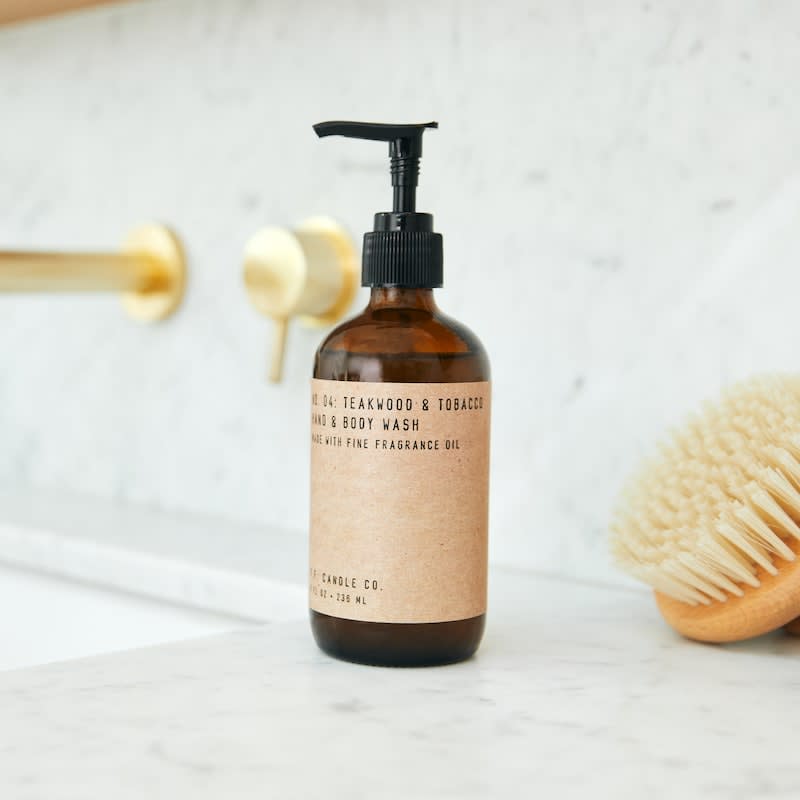 P.F. Candle Co. Hand &amp; Body Wash - Teakwood &amp; Tobacco  - Introducing Hand &amp; Body Wash, our first-ever body care collection meant to transform the day’s most essential task into one worth looking forward to.  Made with Castile-based soap and fine fragrance oils, this gentle-yet-effective cleanser leaves the skin lightly fragranced and the mind a bit clearer. Formulated first for the hands but suitable for the entire body, this collection is vegan and cruelty-free, contains no sulfates, parabens, or phthalates, and is packaged in recyclable glass bottles to fit right in with any home decor. Scent Description The one that started it all. Some call it the boyfriend scent, we call it the O.G. Notes of leather, teak, and orange.  Shipping only available within the US. Made in United States of America  