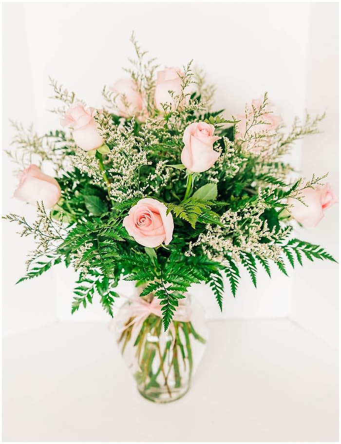 One Dozen Pink Roses - If she's still the queen of your heart, show her with this regal, awe-inspiring bouquet of pink roses!