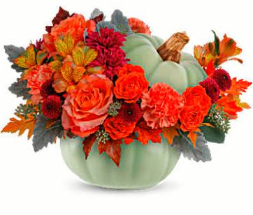 Sage Harvest Bouquet - This arrangement features orange roses, spray orange roses, orange alstroemeria, orange carnations, purple button spray chrysanthemums, purple cushion spray chrysanthemums, dusty miller, seeded eucalyptus, and is delivered in Teleflora's Sage Harvest Pumpkin. The perfect blend of autumn hues and floral elegance for any occasion.