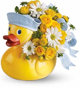 Just Ducky - Baby Boy Just Ducky - Baby Boy - Sunny yellow spray roses, yellow button spray chrysanthemums and white daisy spray chrysanthemums are perfectly arranged with a light pink or blue ribbon in an exclusive Just Ducky container. Hand- not stork-delivered! It's delightful. Please specify boy or girl.