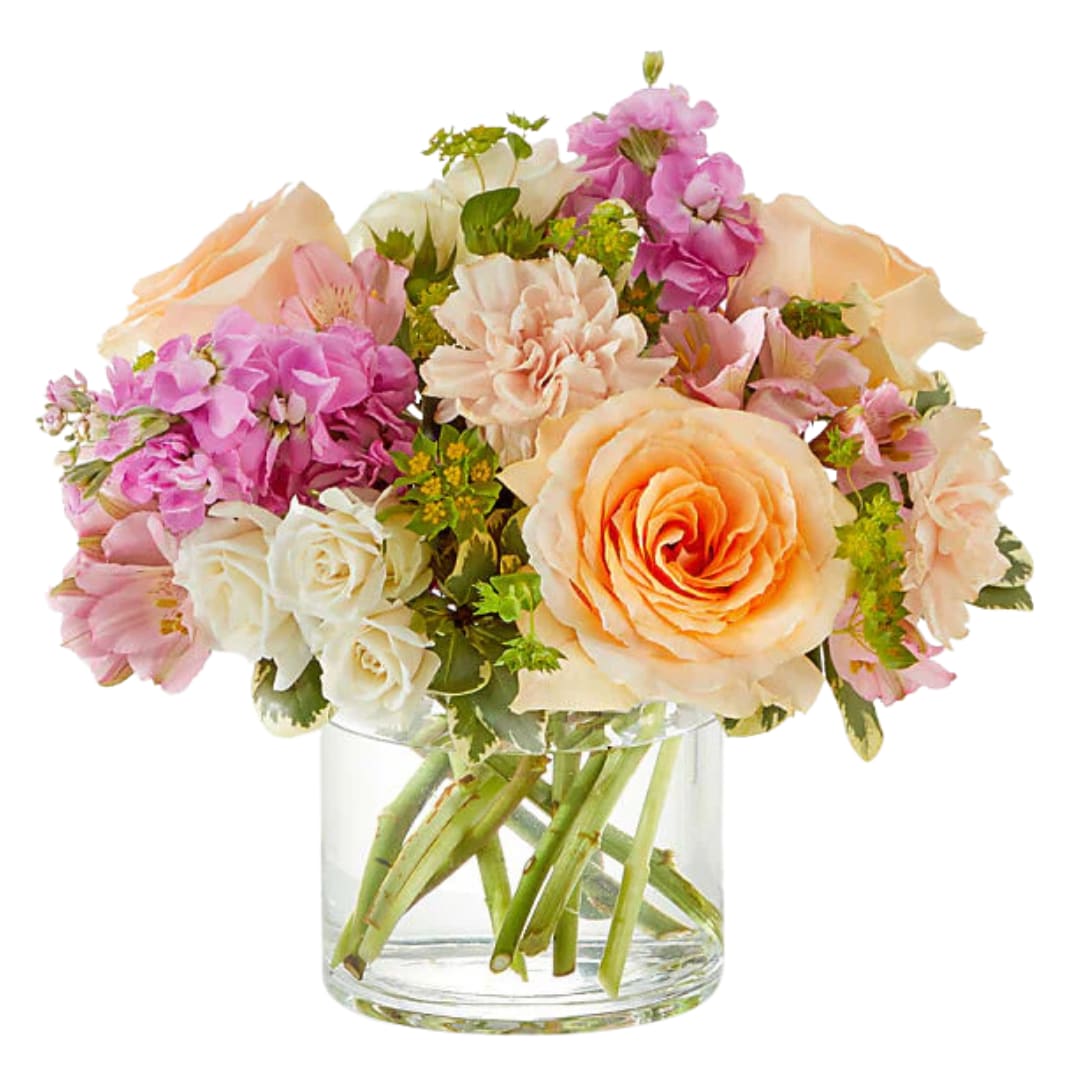 Just Peachy - &quot;Just Peachy&quot; is a delightful arrangement that exudes elegance and charm with its soft, refreshing colors. The gentle peach roses offer a warm, inviting glow, while the lavender stock adds a touch of grace and fragrance, creating a calming atmosphere. Ivory spray roses add a soft, romantic accent, completing this serene, yet sophisticated bouquet. Perfect for any occasion, &quot;Just Peachy&quot; is the epitome of sweet simplicity and beauty, bringing a touch of warmth and tranquility to any space. 