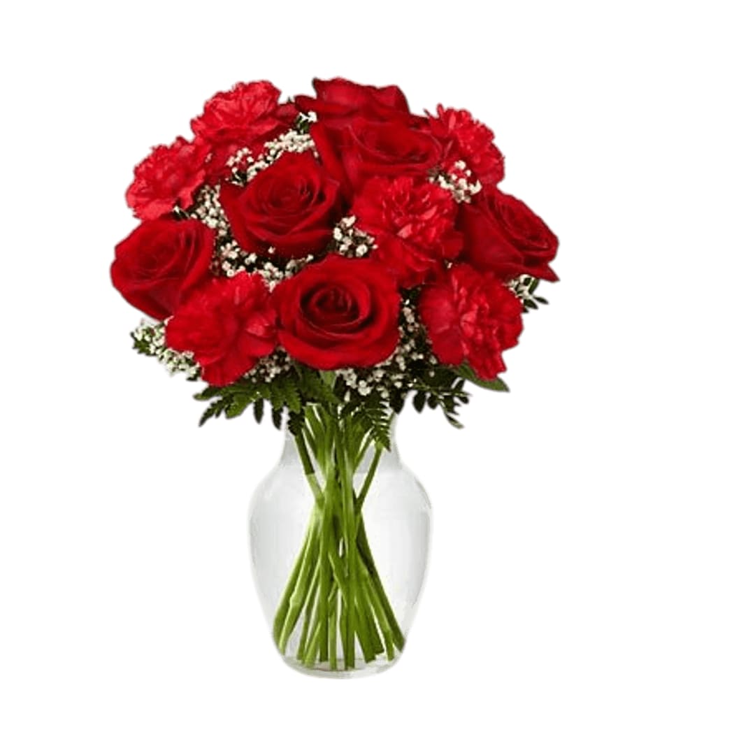 Sweet Perfection Sweet Perfection - The Sweet Perfection Bouquet is an eye-catching way to capture their attention. Rich red roses and carnations are beautifully set amongst baby's breath and lush greens in a classic clear glass vase to create a sweet sentiment of love and affection.