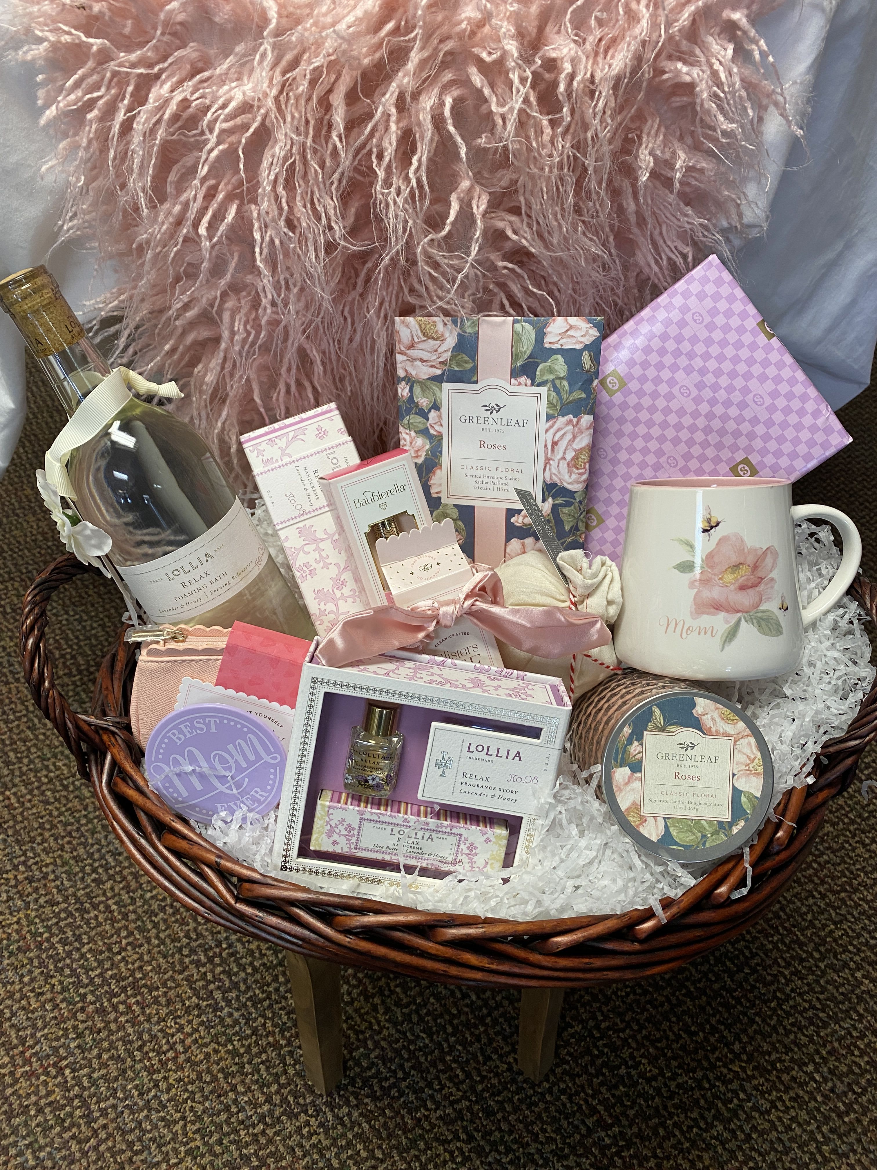 The Deluxe Spa Basket The Deluxe Spa Basket - The Deluxe Spa Basket Includes: 1 Relax Foaming Bubble Bath, 1 Bath Salt Bag, 1 Greenleaf Rose Candle, 1 Greenleaf Rose Sachet, 1 Relax Luxurious Hand Cream, 1 Travel Size Relax Perfume and Hand Cream, 1 MissFixIt Jewelry Repair Clutch, 1 Blisters Bee Gone, 1 Bling Brush with a Pink Scrunchie, 1 Floral Mom Mug, and 1 Pound See's Chocolate