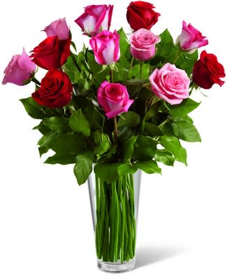 True Romance Rose Bouquet True Romance Rose Bouquet - The True Romance Rose Bouquet is the perfect expression of love and passion to make this a truly memorable arrangement. A bright burst of color, this bouquet combines red, pink and fuchsia roses, to make a dozen, accented with beautiful greens and seated in a clear glass vase, to create a truly romantic representation of your love.