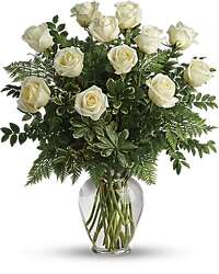 One Dozen White Roses in a Vase - An elegant bouquet of white roses arranged in a clear vase.
