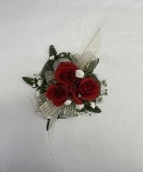 3 SPRAY ROSES CORSAGE 3 SPRAY ROSES CORSAGE - 3 SPRAY ROSES (RED, WHITE, OR LIGHT PINK), WITH GREENS, BABIES BREATH AND RIBBON OF YOUR CHOICE. INCLUDES COMPLIMENTARY STANDARD WRISTLET.