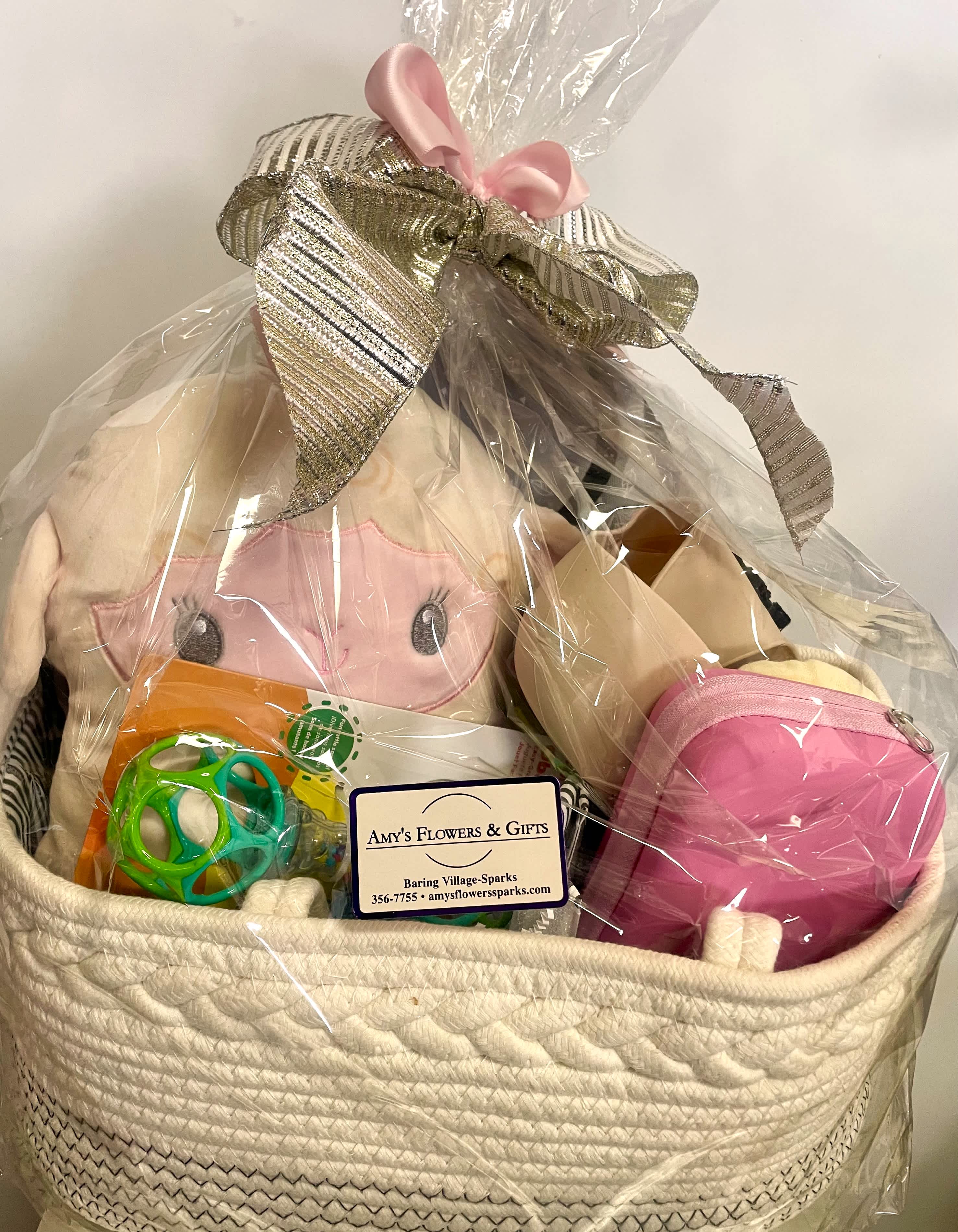 Baby Girl Welcome Nursery Basket - Great welcome home for the new baby girl! All quality items; all cotton nursery bag / diaper bag, changing pad, cuddle puff, baby nail care kit, and more. Beautifully packaged. Perfect for the new baby and mom! 