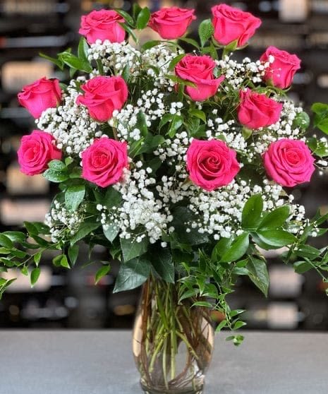 pink elegance  - enjoy these amazing ravishing pink roses with special love and make that special someone blush. these pink roses bring 12 roses added with white baby breath and a glance of green leaves with a clear vase.