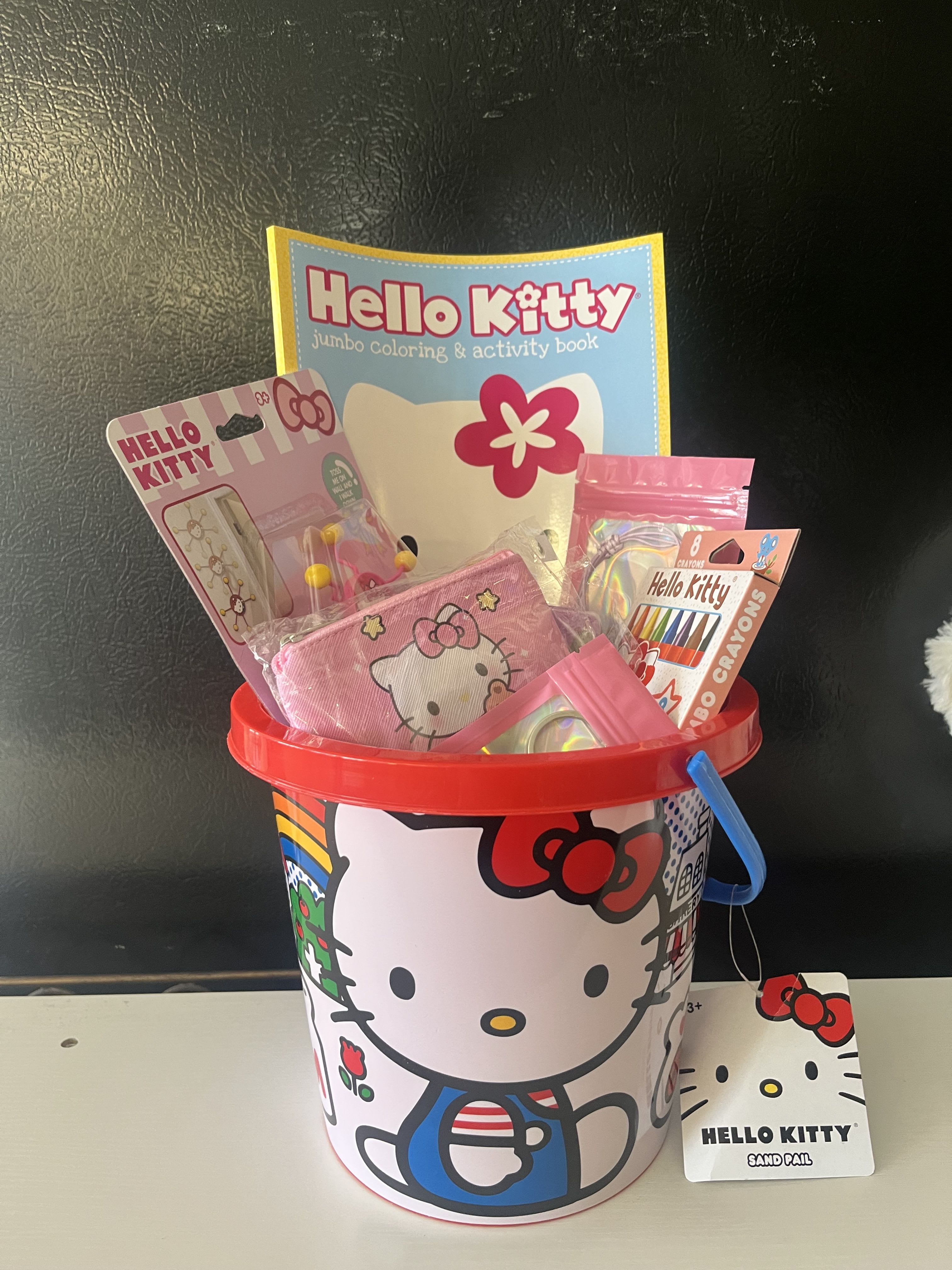 Hello Kitty Gift Basket  - Hello Kitty basket comes with coloring book with crayons ,  coin bag , key chain , slime and others  