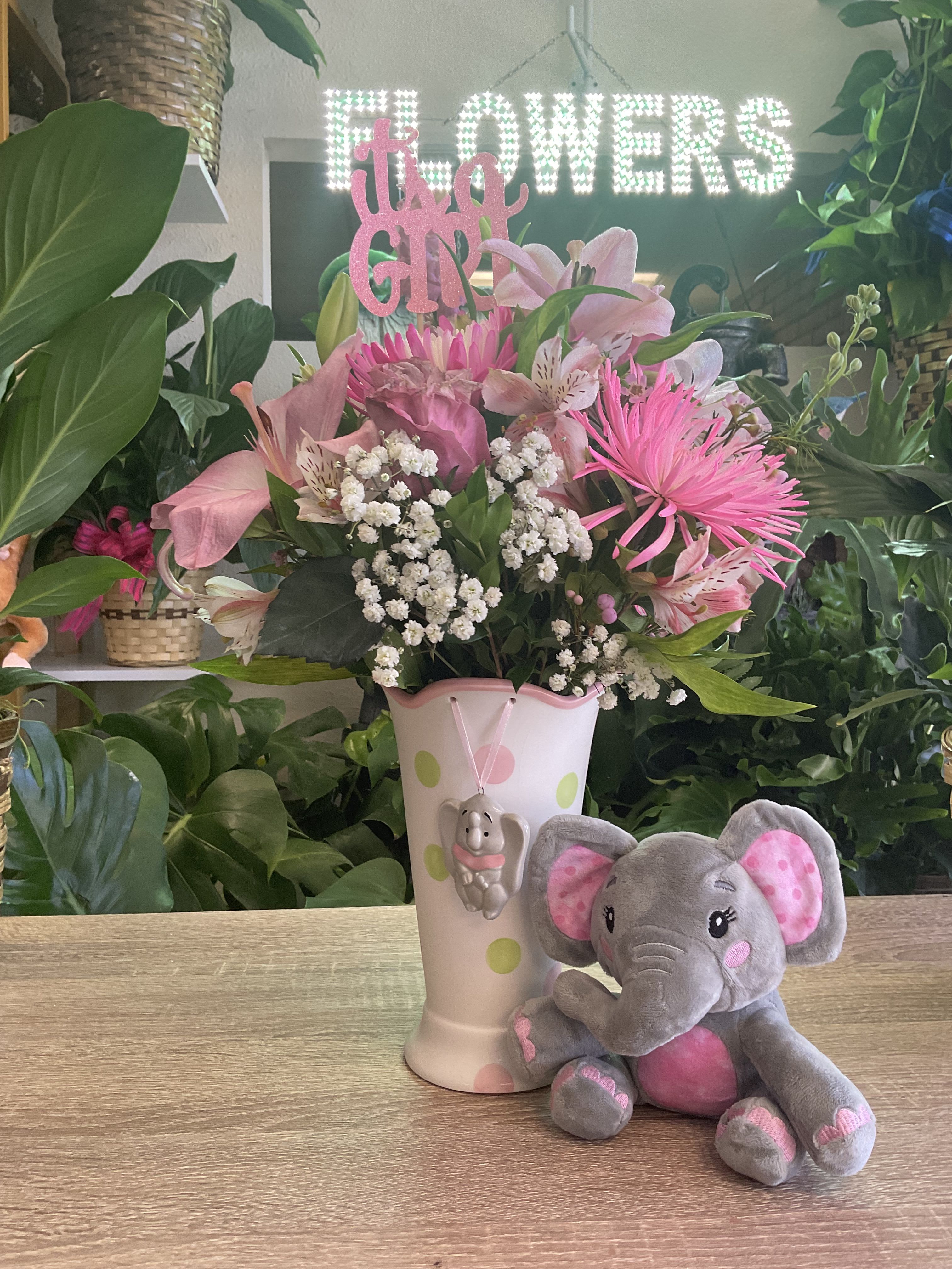 Its a girl Its a girl - fresh pink flowers carnations, roses , spiders , alstroemeria and lilies with elephant vase attach pink snuggly elephant
