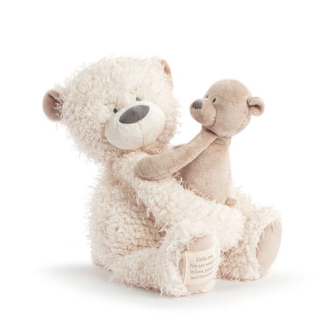 Wrapped in Prayer Teddy Bear - Inspirational message on the bear: Little One, You are wrapped in love, prayers, and blessings. Perfect gift for new babies and little ones. Dimensions: 12&quot; x 7&quot; x 16&quot; Materials: polyester fiber Care Instructions: Surface Washable