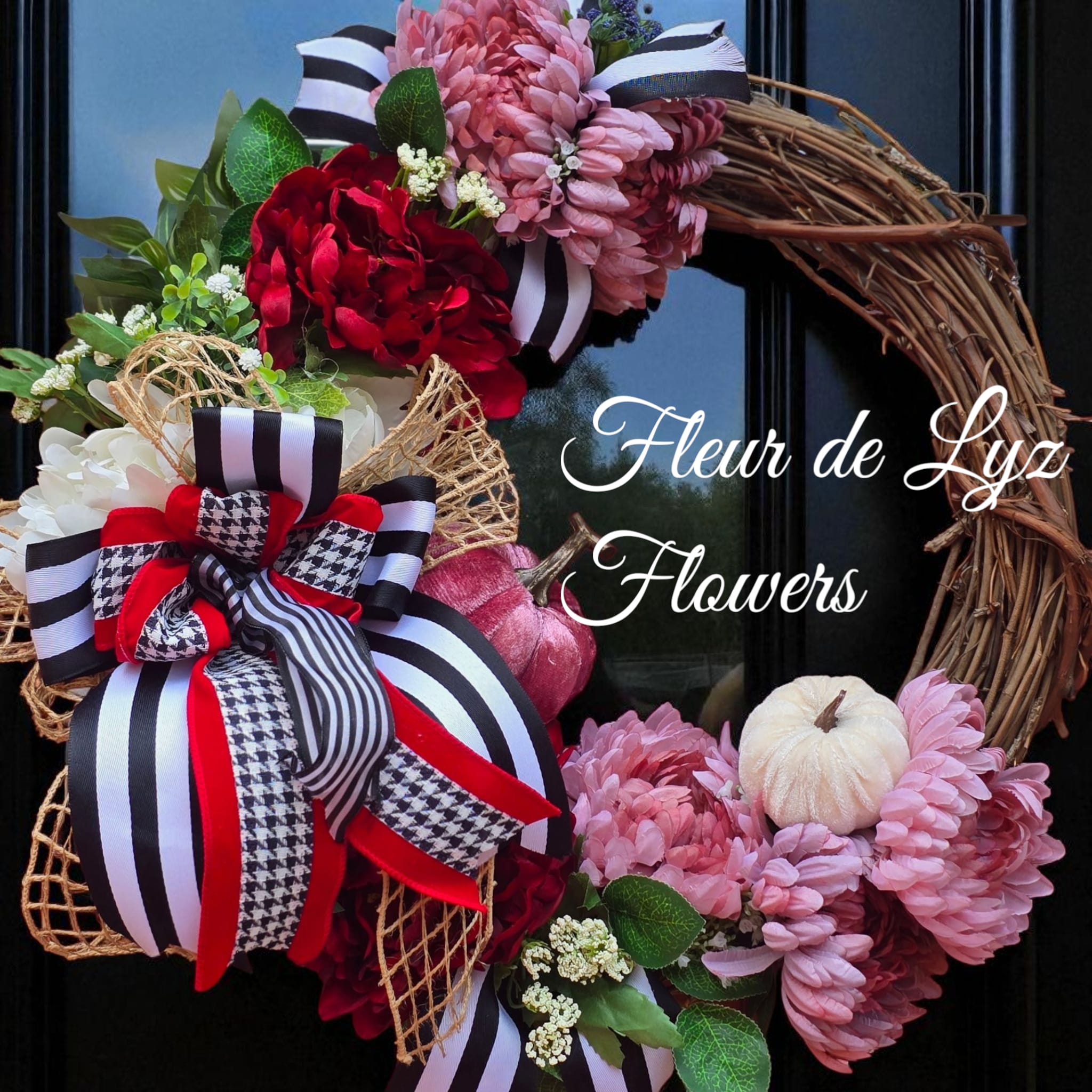 Autumn Elegance Wreath Autumn Elegance Wreath - A mix of soft blush mums, rich red blooms rustic pumpkins and designer ribbon-The perfect touch of charm for your door this fall.
