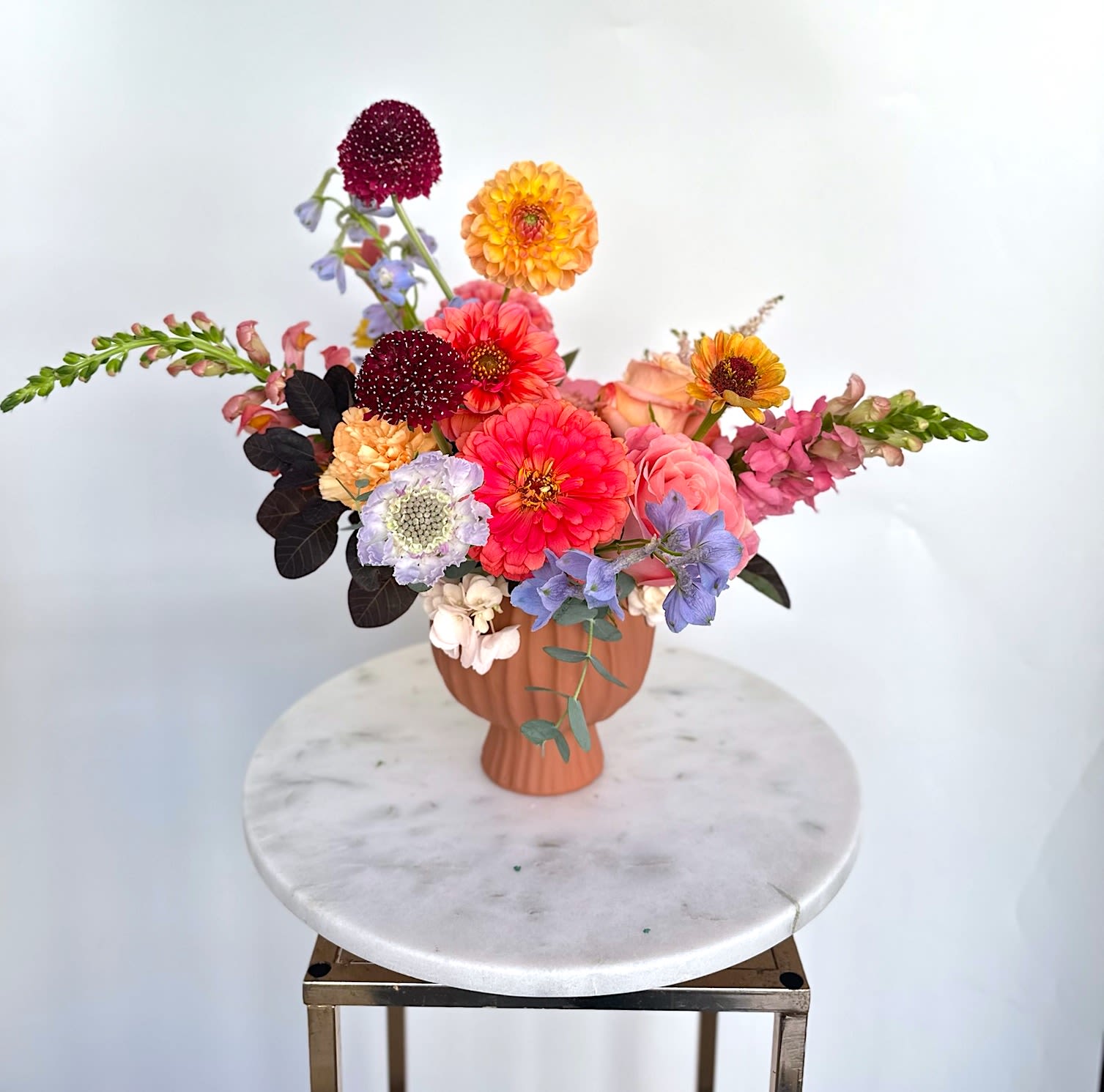 Fall Dreams - Dahlias, roses, and zinnias - the perfect trio for fall.  A timeless arrangement crafted in a clay vase.