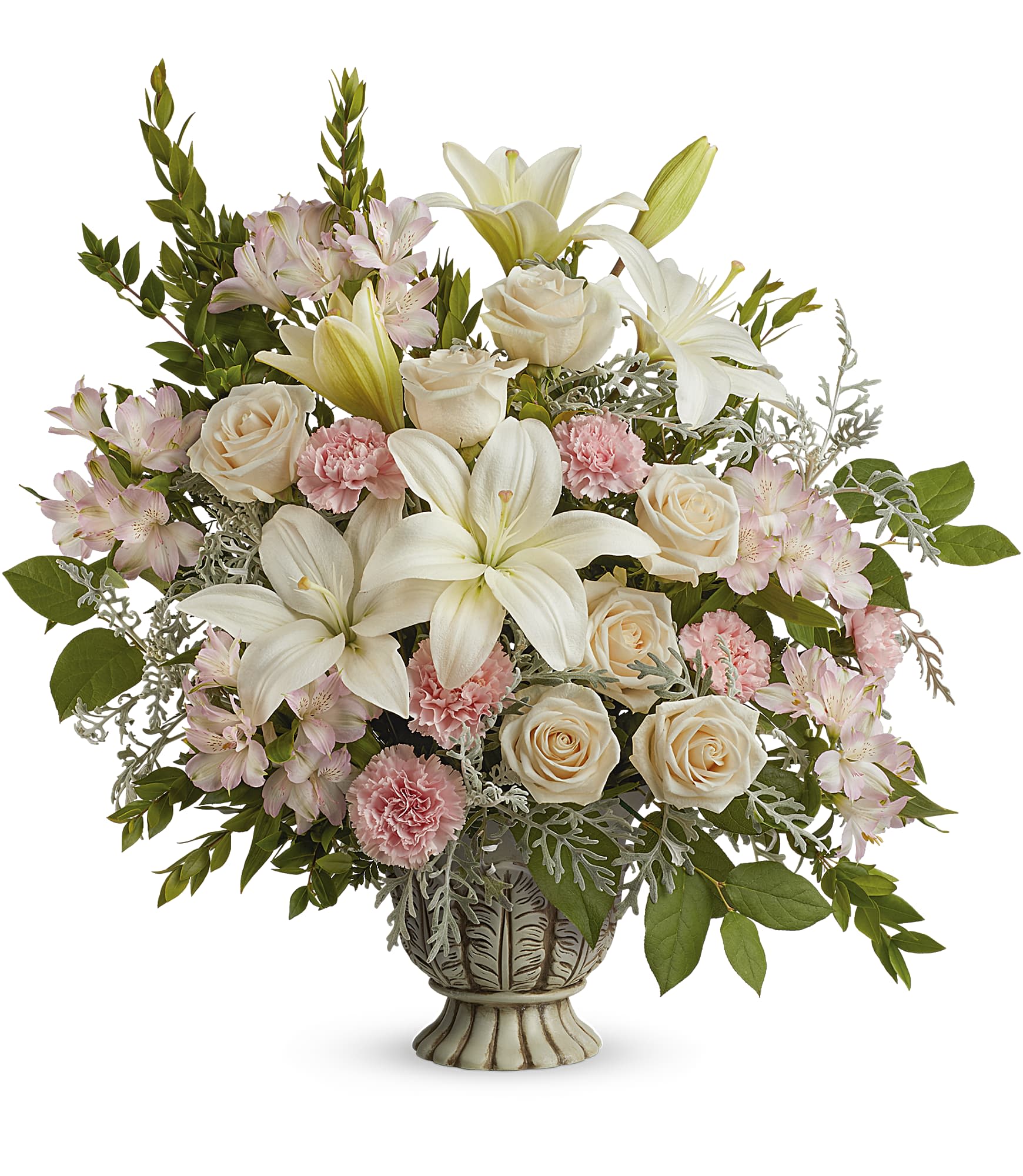 Teleflora's Peaceful Joy Bouquet - Bring peace and joy to life's most special moments with this classic urn, brimming with an impressive rose bouquet. This bouquet features crème roses, white asiatic lilies, light pink alstroemeria, pink carnations, silver lace dusty miller, lemon leaf and myrtle. Delivered in Teleflora's Thoughtful Tribute Pot.