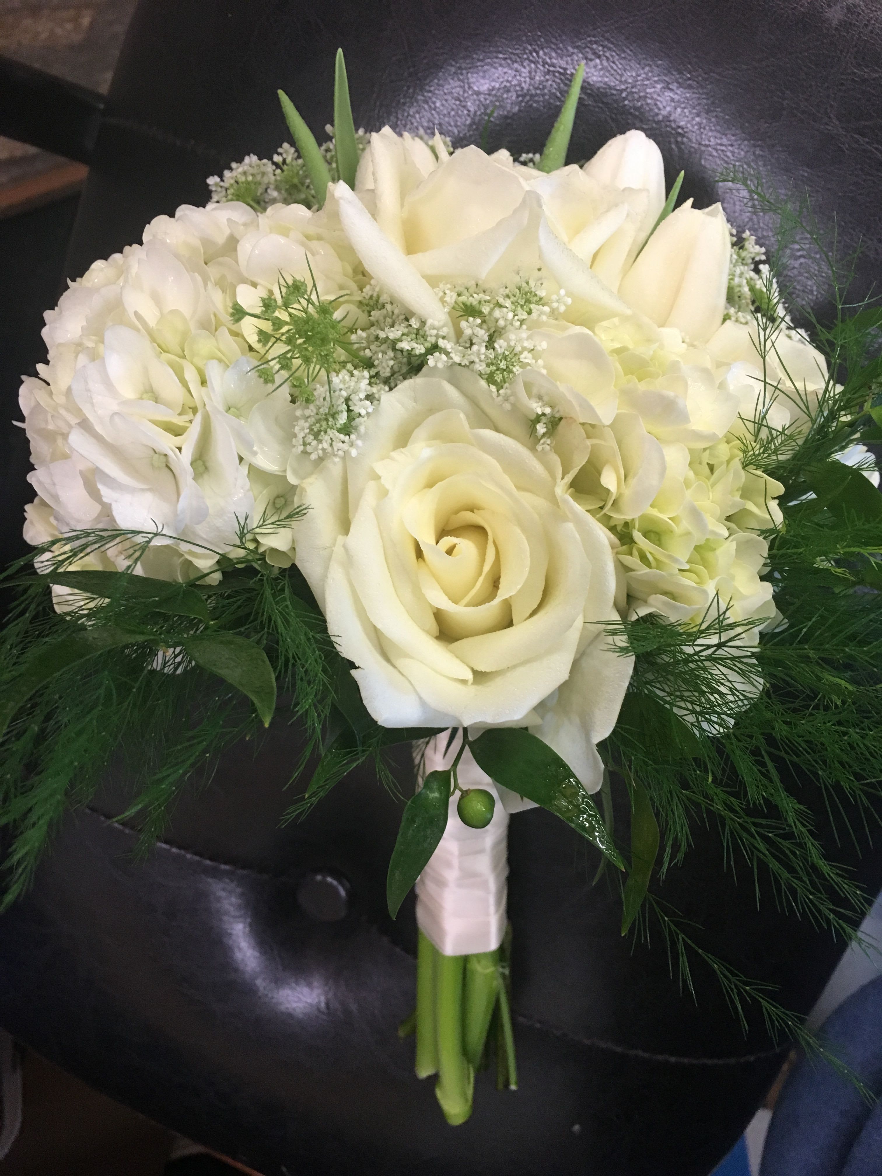 Hand held Bouquet Hand held Bouquet - Fresh flowers accented with seasonal foliage and filler. Stems are wrapped with ribbon color of your choice. (Specify color choice or scheme in special instructions)