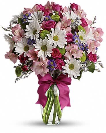 Pretty Please - Looking for the prettiest bouquet in town? We've got the perfect all-around choice - a mix of blooms in breezy shades of pink, white, lavender and more, all tied up with a big pink bow! A great way to make someone smile. A mix of fresh flowers such as spray roses, daisy and button spray chrysanthemums, Monte Cassino asters and limonium, in shades of white, pink, green, purple and lavender. Delivered in a vase adorned with a matching ribbon.