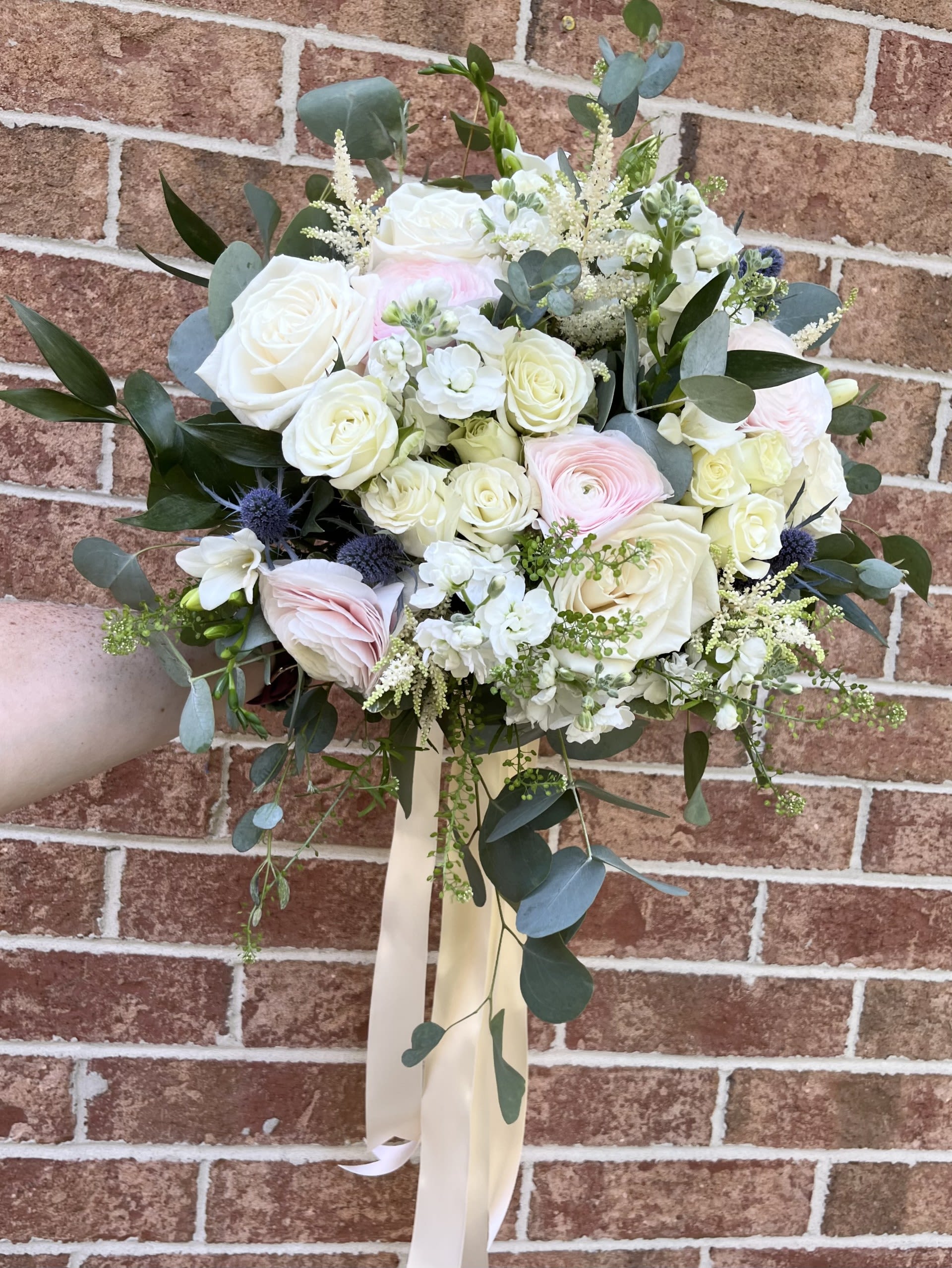 Thistle and Lace Bridal Bouquet by Chasing Petals - Soft and romantic vibes only with this bridal bouquet! Mixed white flowers with touches of blue thistle, blush pink ranunculus and soft flowy eucalyptus, this bouquet is sure to wow on your big day, and in all your pictures for years to come!