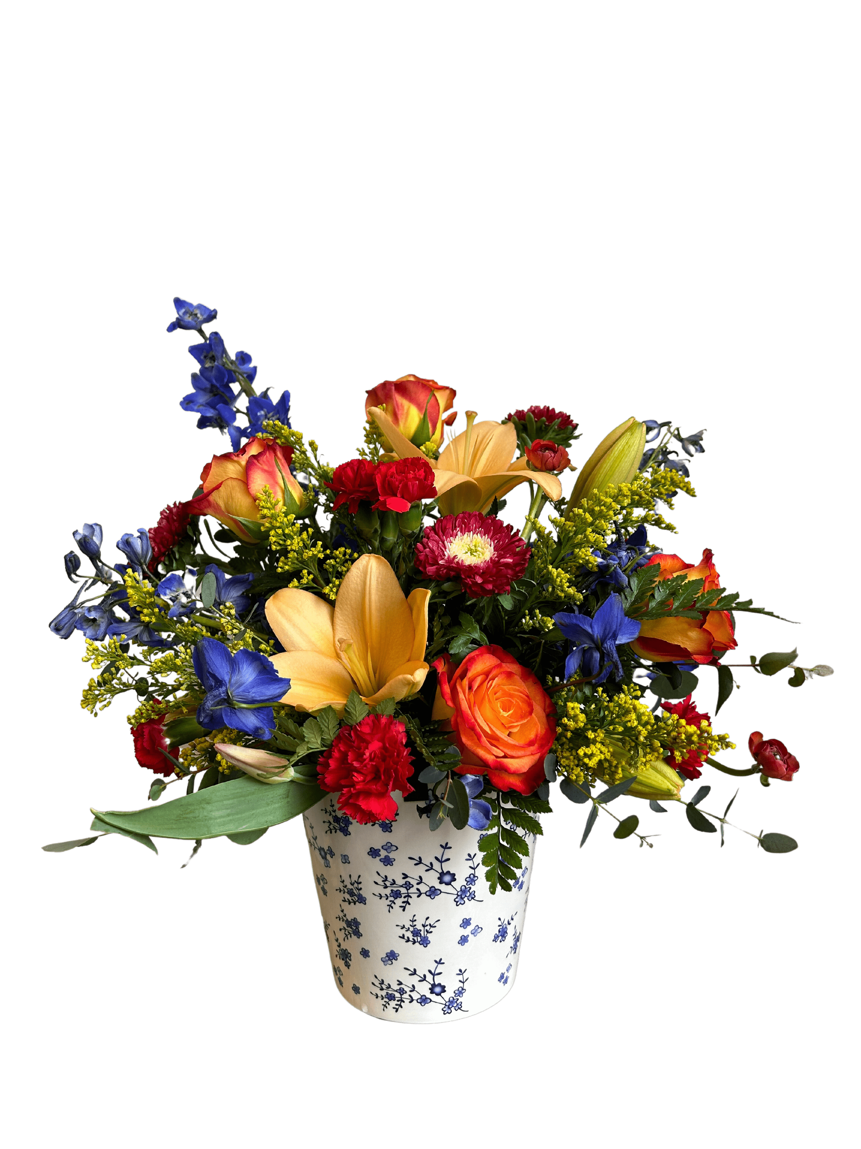 Mamma Mia Mamma Mia - A beautiful Blue and White Ceramic container filled with bright blooms of delphinium, roses, carnations, lilies, matsumoto asters and a variety of beautiful greenery