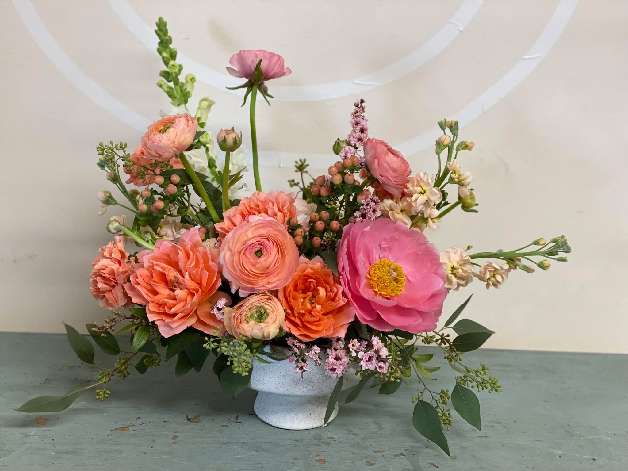 I love you Mom - A modern, minimalist arrangement featuring ranunculus, peonies, garden roses, and seasonal blooms - thoughtfully designed to make Mom feel celebrated this Mother’s Day.
