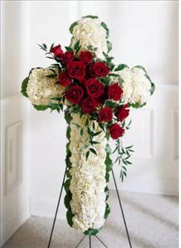 WHITE CROSS & RED ROSES WHITE CROSS & RED ROSES - ALL WHITE CROSS WITH A SPRAY OF RED ROSES DOWN THE CENTER