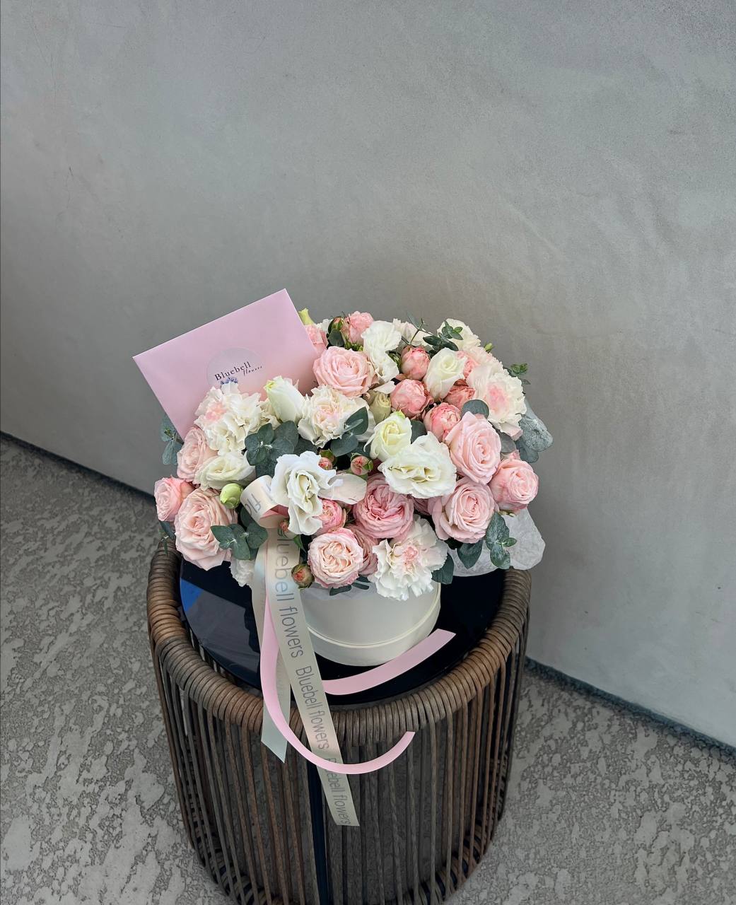 Light Pink Glow - Light Pink Glow A gentle bouquet that radiates softness and charm. Featuring spray roses, carnations, lisianthus, and eucalyptus — all in delicate shades of light pink and cream. This arrangement is a subtle glow of elegance, perfect for moments filled with tenderness and love.