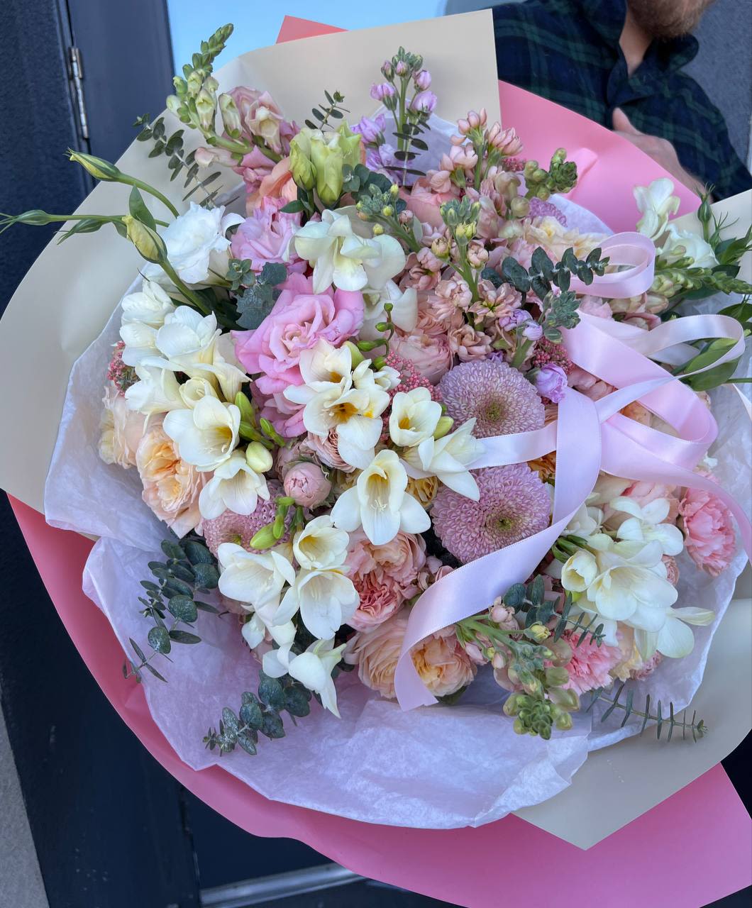 Princess’s Choice  - Princess’s Choice – a bouquet fit for a true princess. Soft shades of pink, cream, and white create an atmosphere of elegance and lightness, like a page from a Disney fairy tale. Fragrant freesias, exquisite roses, and airy chrysanthemum petals blend harmoniously with delicate lisianthus, lush carnations, and elegant snapdragons. The graceful touch of boat orchids adds an exotic charm, while the subtle fragrance of matthiola enhances the bouquet’s enchanting aura. Eucalyptus leaves weave through the arrangement, bringing a fresh, natural balance to this dreamy floral composition.