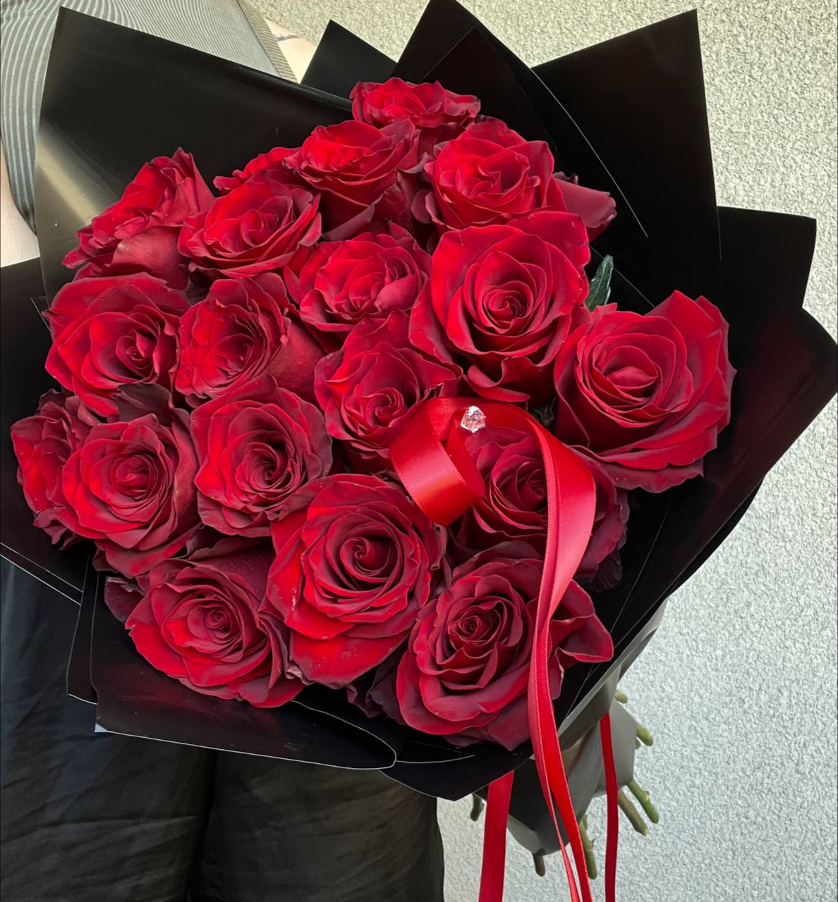 Royal Devotion - “Royal Devotion” – a magnificent bouquet of two dozen scarlet roses, symbolizing devotion, passion, and eternal love. 24 luxurious blooms, like fiery hearts, are wrapped in elegant packaging that enhances their depth and richness of color.  This bouquet is the perfect gift for someone special—whether it’s a declaration of love, an anniversary, or a moment to be remembered forever. Timeless elegance that speaks louder than words. 