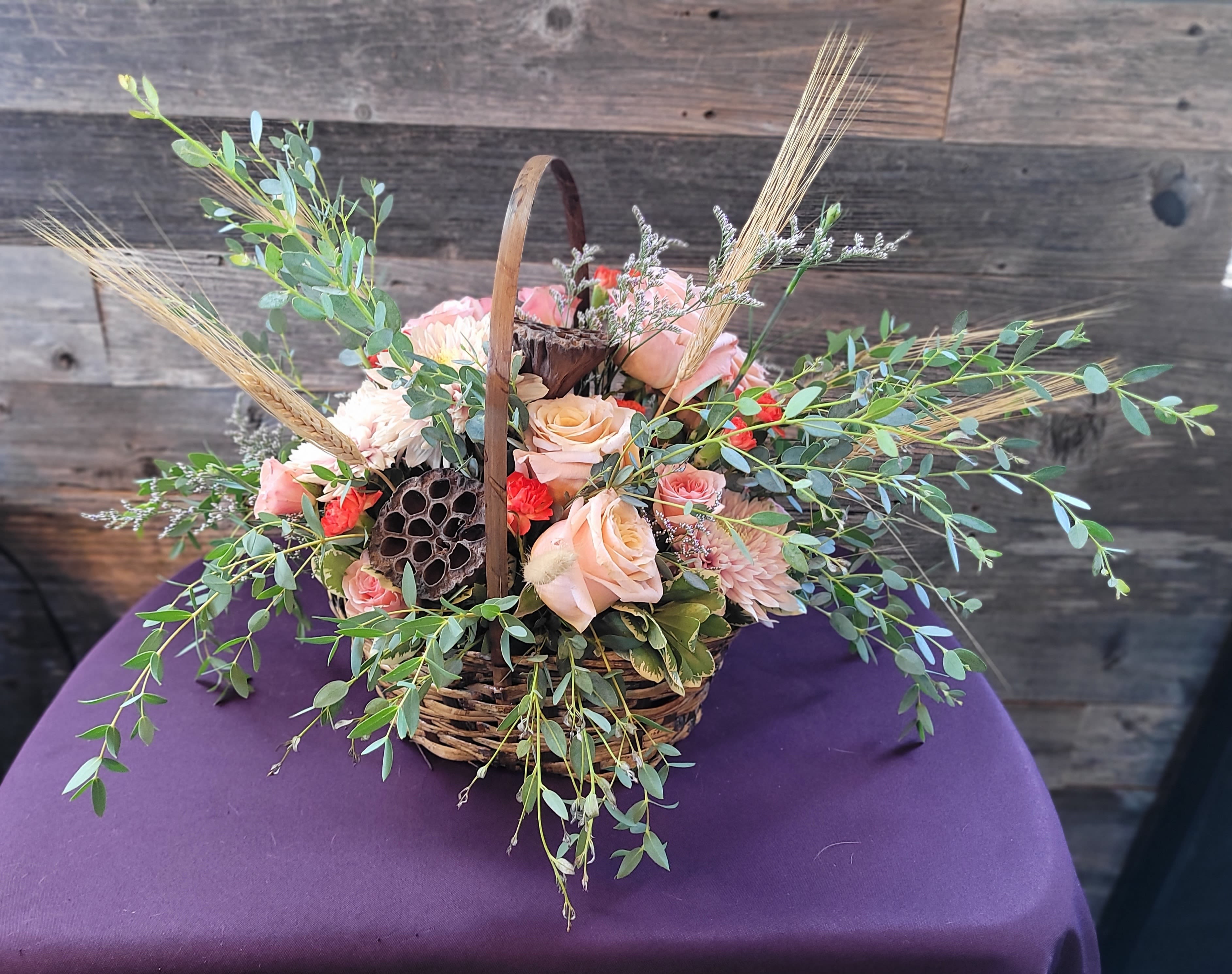 Homestead Homestead - A warm, inviting arrangement in a rustic basket, blending rich and soft tones with fresh greenery for a welcoming, hand-gathered feel. A gentle reminder that the simplest moments can be the most beautiful. Perfect for housewarmings, thank-yous, or adding a comforting touch to any space.