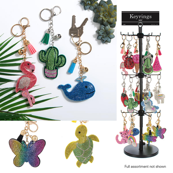 Sparkle Key Ring - Add these fun key rings for a added playful gift with your flowers. These key rings are a vibrant and playful collection, combining utility and fun design. Here's a  These key rings come in various charming shapes, including: Flamingo Cactus Whale Turtle Butterfly Other shapes like unicorns, rainbows, and more, visible on the rotating display stand. Each key ring is adorned with sparkling rhinestones, adding a glittery and eye-catching effect. Gold and silver-tone metal chains and rings add a touch of elegance. Many designs are complemented with colorful tassels or small bells for an extra playful detail. Bright and cheerful, with a variety of hues such as pink, green, blue, yellow, and multi-colored gradients