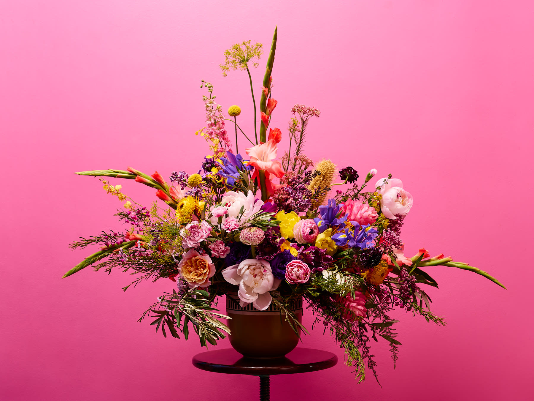 Unconditional Love  - Gift this luxe abundant beauty to show your appreciation, love, and gratitude with the Unconditional Love vase arrangement created using each season's best blooms and bold colors, in a hand-picked ceramic vessel.   **Please note that Brooklyn Blooms move with the seasons, vessels, blooms, and foliage will vary from what you see in the photo. However, it will have the same beauty, uniqueness, and funky style. Please let us know in the florist notes if you have any color preferences or special requests, otherwise, the Bloomies will make a tasteful decision for you! **  ***ALL SPECIAL REQUESTS MUST BE SPECIFIED IN THE FLORIST NOTES SO THAT OUR BLOOMIES ARE AWARE AND CAN DELIVER THE BEST SERVICE. COMMUNICATION IS KEY!!****  Upgrade Notes: Please note that with each upgrade the Bloomies will choose a mix of blooms, premium foliages, and filler to enhance your arrangement for the best presentation!  