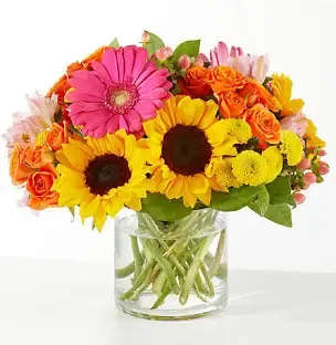 Happy Day! - Brightness in a robust collection of seasonal flowers. 