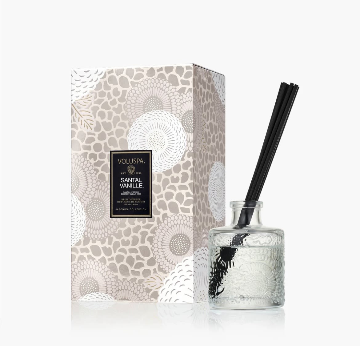 SANTAL VANILLE REED DIFFUSER - A veil of intoxicating vanilla, exotic oud and warmest sandalwood mingle in a sensually smooth, creamy brulée, casting a quiet glow from lust-worthy, pearlescent glass as captivating as the fragrance. Vanilla lovers, you’re welcome. Provides 4-6 months of fragrance.
