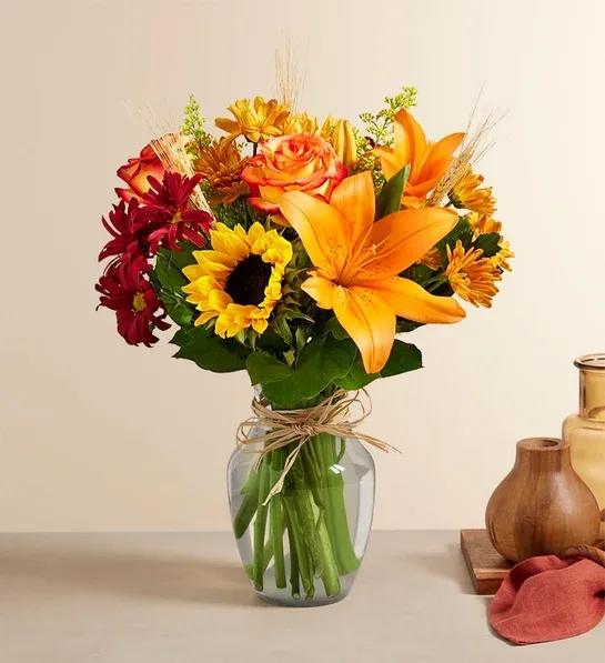 Fields of Europe for Fall - Inspired by the colorful charm of the European countryside, our best-selling autumn bouquet is gathered with fresh-picked flowers, revealing the rustic beauty of nature. Shades of golden yellow, rich red and pops of orange create a timeless gift for someone special to enjoy.