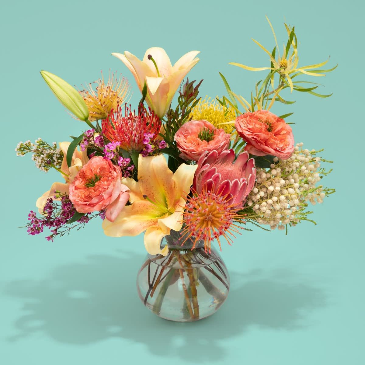 Flamingo - Your arrangement will be designed in the style shown but flowers and containers may be different from that pictured.