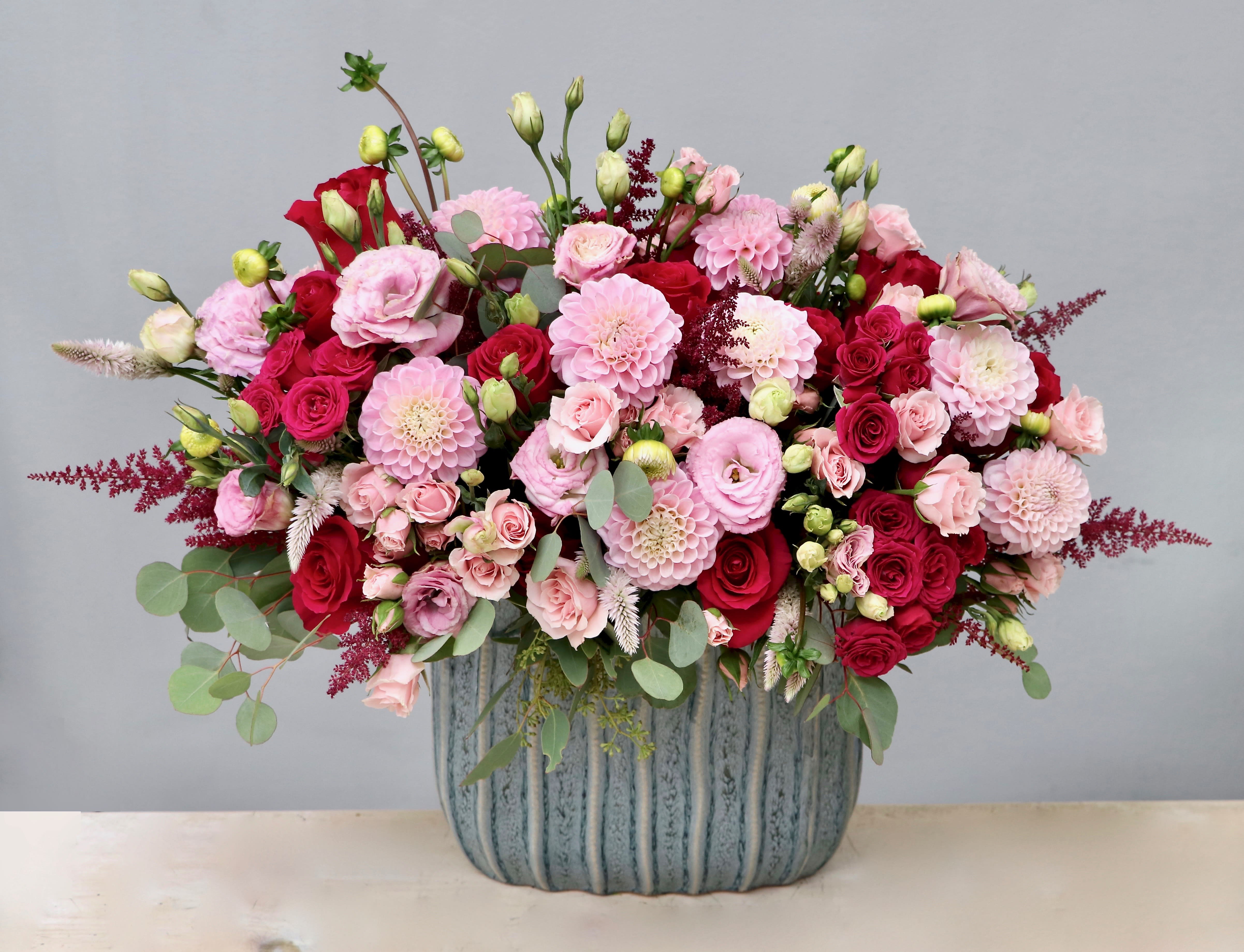 The Sweetest Thing - My Glendale Florist  - This majestic arrangement showcases an elegant design. Roses and dahlias are gathered together with accents of lisianthus and seasonal greenery in the prettiest shades of pink. 