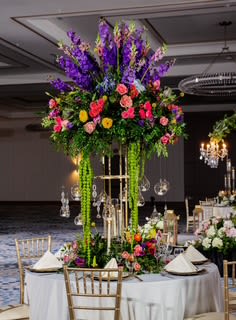 Paradise Colors Paradise Colors - This beautiful arrangement is a mix of flowers with very vibrant flowers, such as; Hydrangeas, Roses, Spray Roses, and Snapdragons. This is one of the bigger centerpieces has a diameter of roughly 36in. It is the biggest of the collection