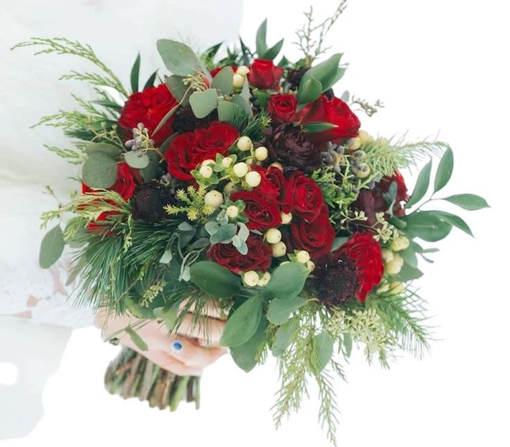 Christmas in Vermont Wedding Bouquet - Stunning red roses, red spray roses, deep purple scabiocia  with Christmas greens, white hypericum berries and eucalyptus  