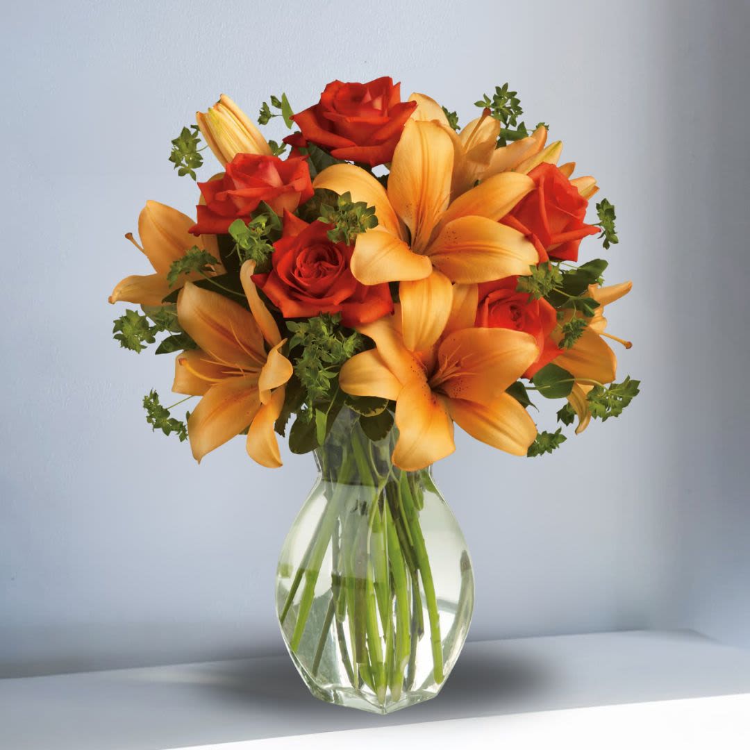 Fiery Lily and Fancy Roses Fiery Lily and Fancy Roses - Spark someone's attention by sending this absolutely radiant bouquet. Full of flowers and fiery beauty, it makes a beautiful gift for any occasion.