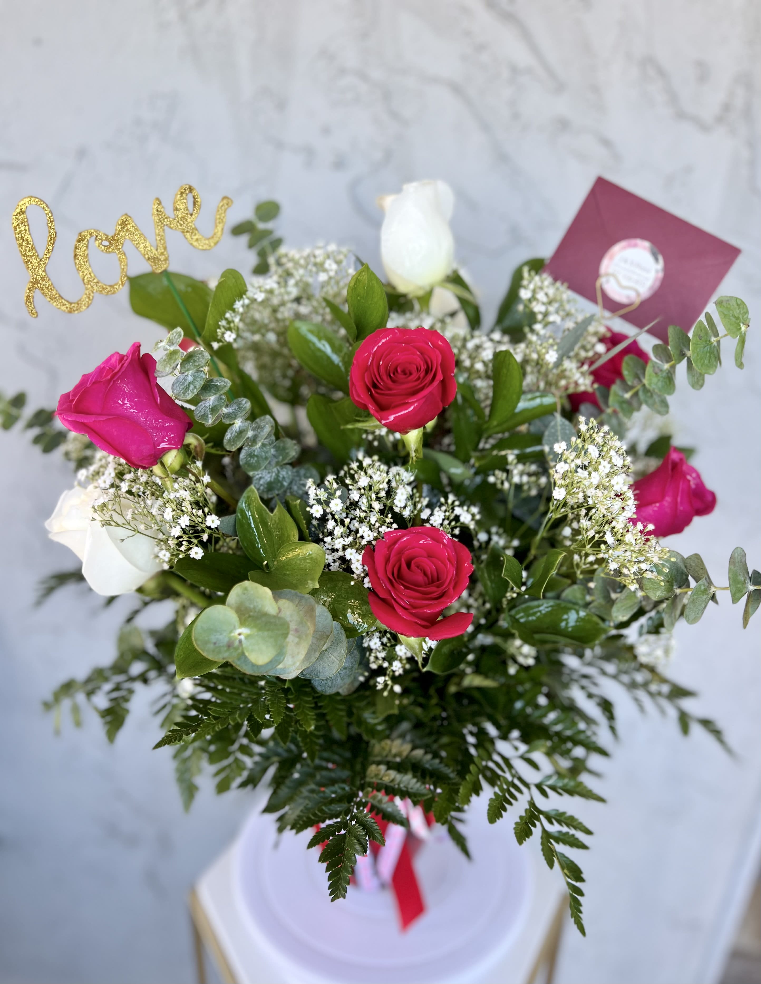 Mix Roses Vase Mix Roses Vase - Mix Roses Vase A stunning mix of roses, accented with baby’s breath and lush greenery, beautifully arranged in a red vase. Perfect for saying I love you or I appreciate Substitution Policy: When you order custom designs, they will be produced as closely as possible to the picture. Please remember that each design is custom made. No two arrangements are exactly alike and color or variety substitutions of flowers and containers may be necessary. Prices and availability of seasonal flowers may vary.
