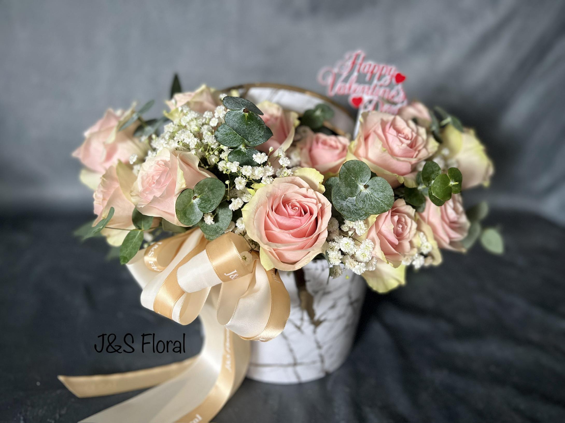 Pink Roses Box  - Pink Roses Box Elegant pink roses with baby’s breath and greenery, beautifully arranged in our white and gold ceramic-look flower box. A graceful way to say I love you or I appreciate you.