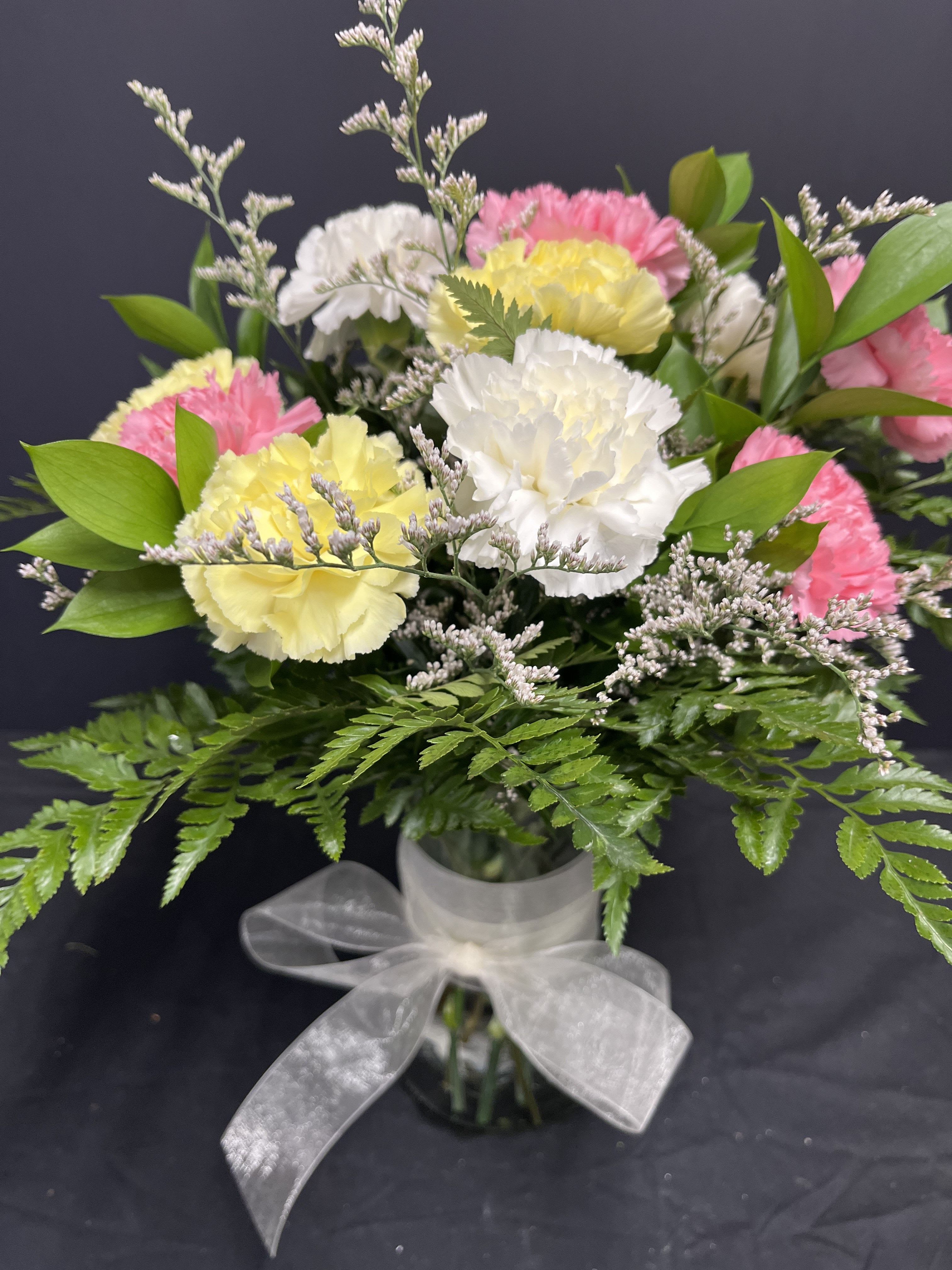 Happy Hour  - Special!!!!  Carnations in vase! A long lasting bouquet for a frend or family celebration. Colors will be florists choice unless specified otherwise!
