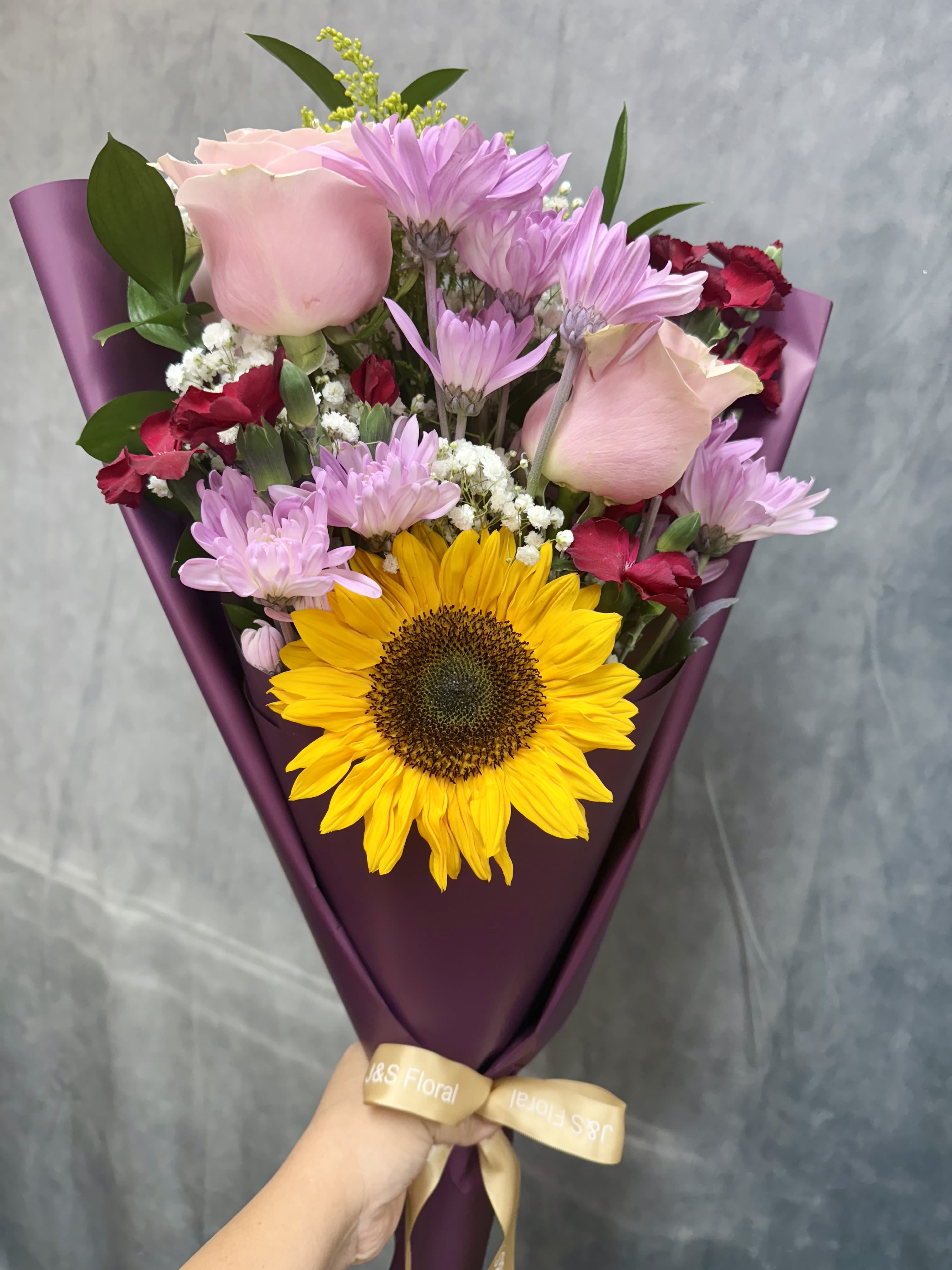 Lavender sunshine bouquet - A delightful fusion of sunny vibrancy and lavender tones with pink toned flowers ideal for bightening up any space or special moment.