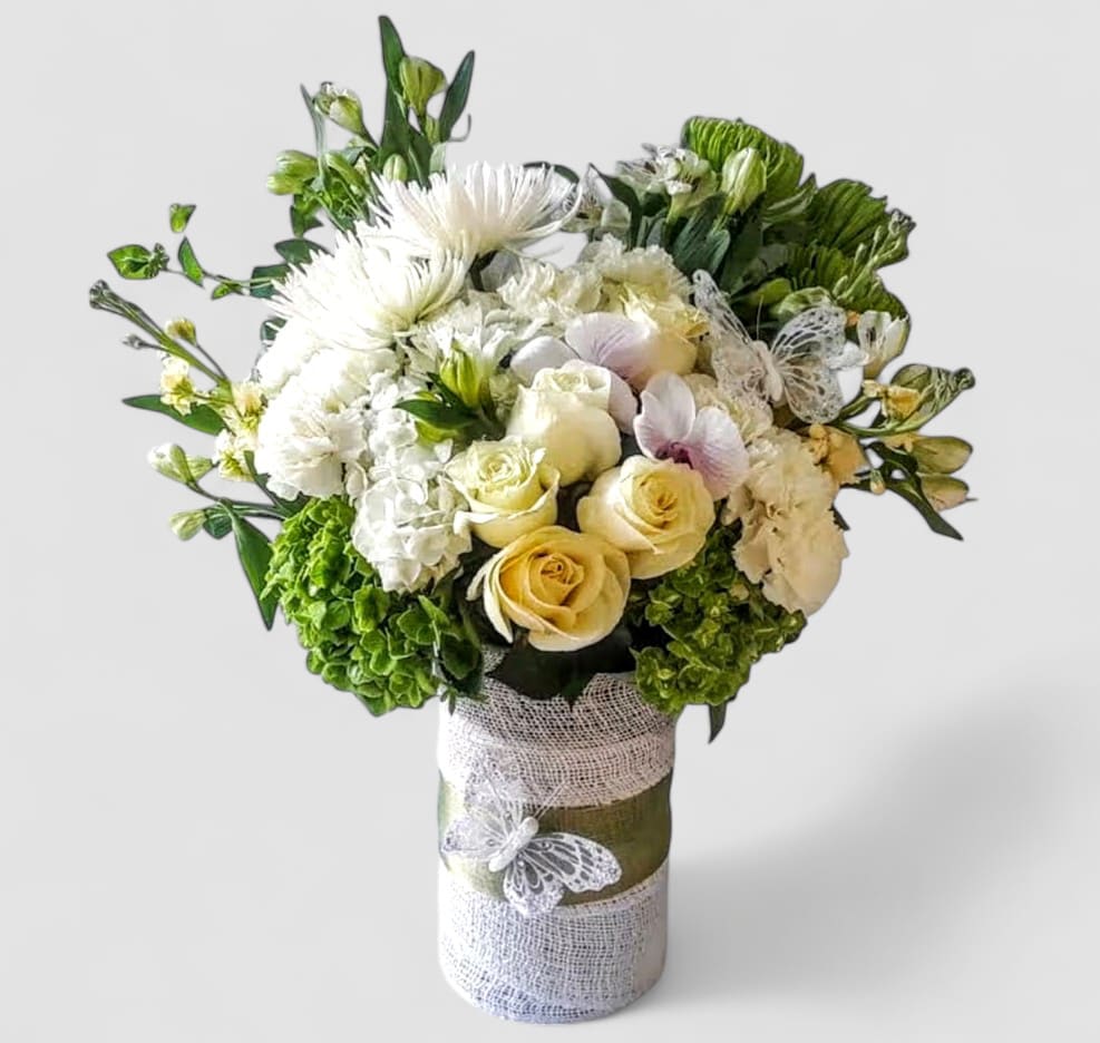 Sympathy Blanca Bouquet Designer's Choice - Roses orchids hydrangeas and more arranged in a tall modern glass cylinder vase wrapped in pretty vanilla jute ribbon. Grand and impressive. Perfect to send to the service or the home to show them how much you care. All of my bouquets are always made extra special and unique each and every time. Send them your deepest condolences. Send them beautiful.