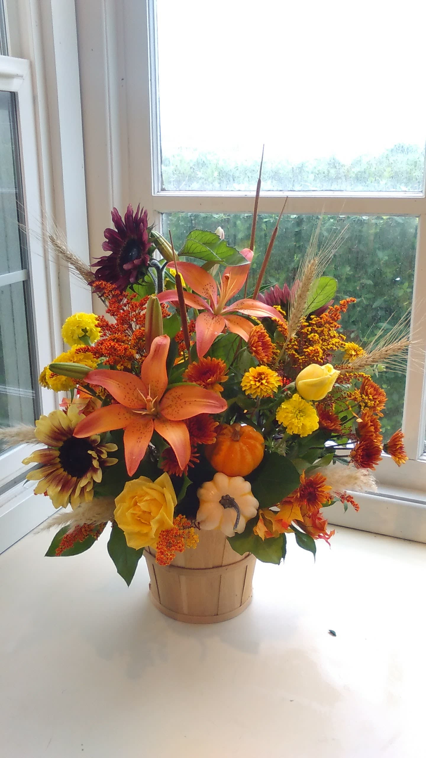 Apple Basket full of Flowers Apple Basket full of Flowers - This is a an adorable mix of fall flowers in a apple basket.