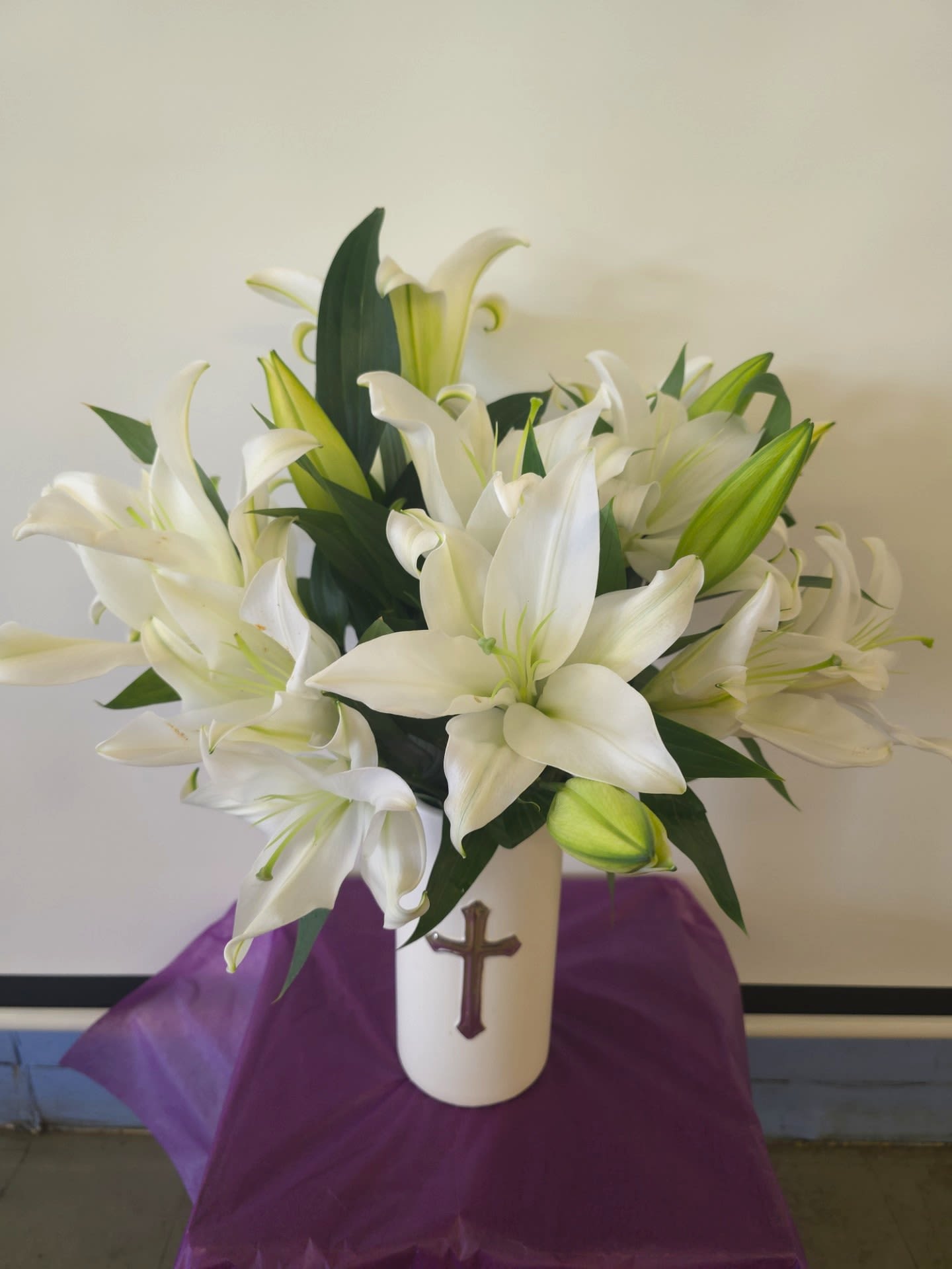 Peaceful Lilies Peaceful Lilies - Beautiful white vase with cross in front filled with fragrance white oriental lily's