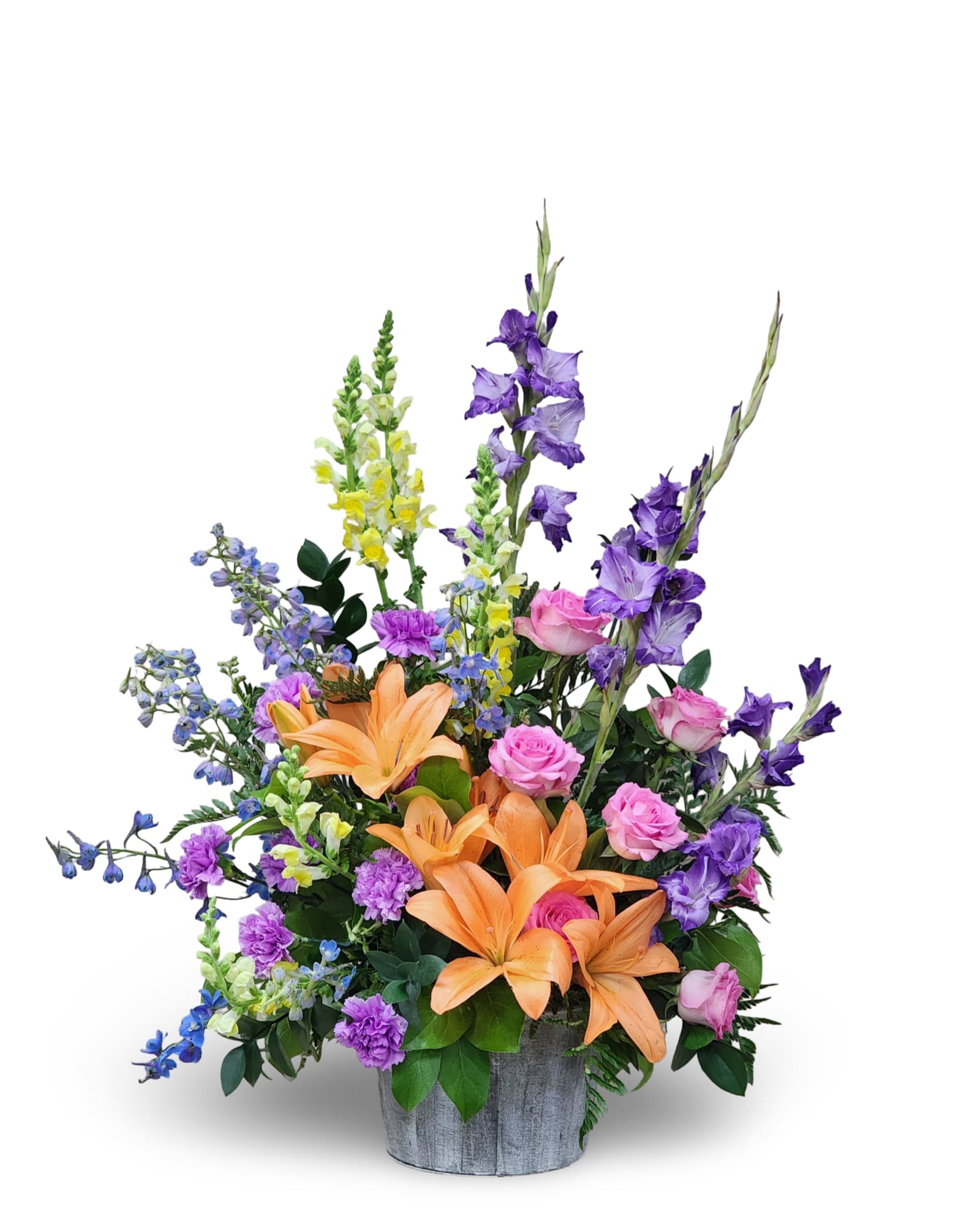 Bright Memories Bright Memories - Bright Memories is a large, one-sided arrangement standing approximately 37 inches tall by 26 inches wide. Designed in a rustic wooden pot, it bursts with vibrant seasonal blooms in a mix of cheerful colors. Perfect for funerals, celebrations, or special events, this arrangement brings warmth and beauty to any setting. Exact flower varieties and colors may vary, ensuring each piece is uniquely special.